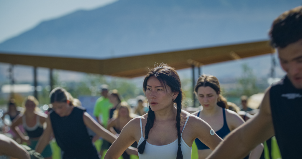 A closeup of a woman in the middle of a workout.